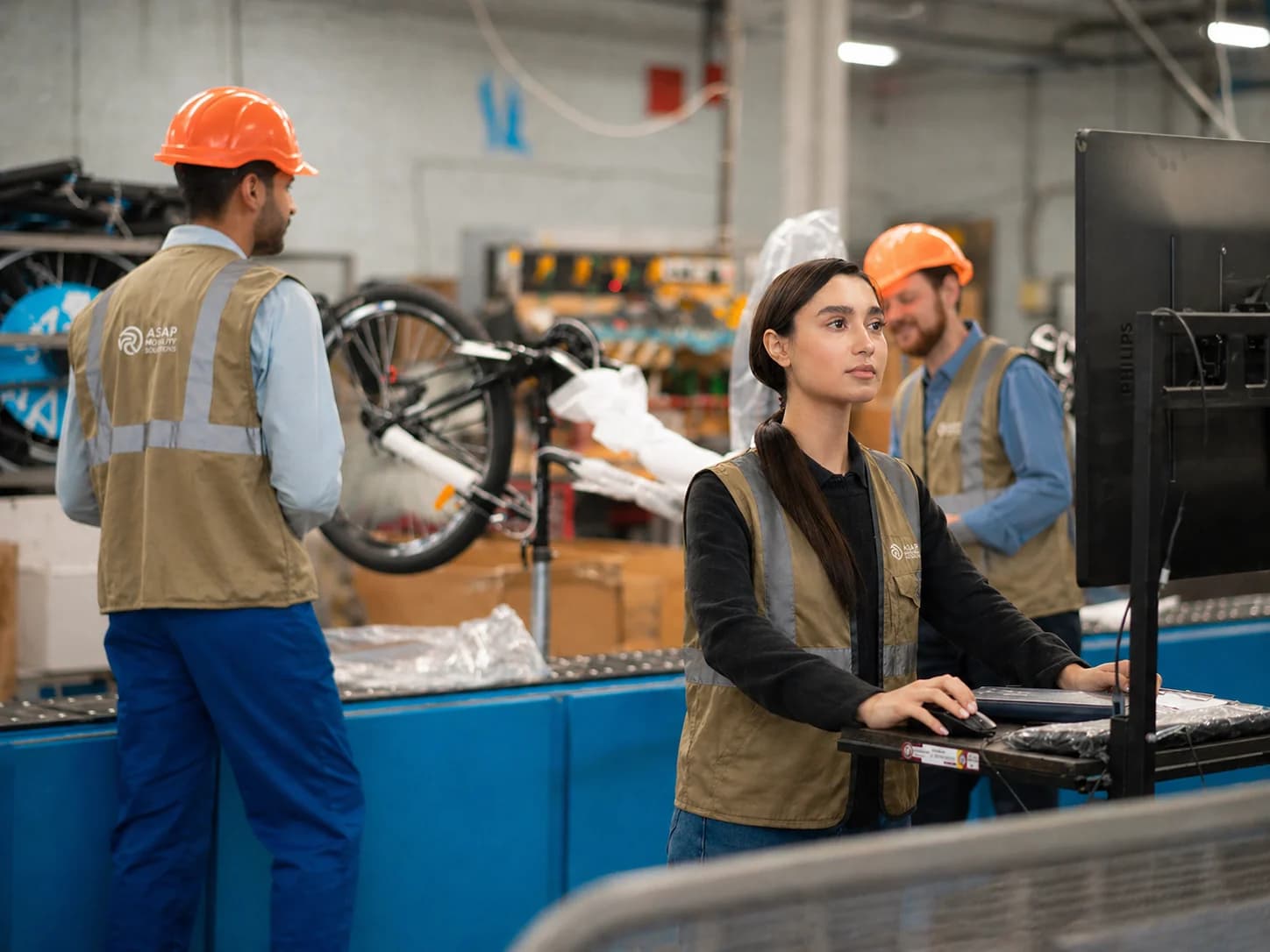 ASAP Reverse Logistics warehouse team inspecting returns and using operational technology